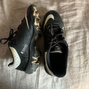 Girls black Nike softball cleats